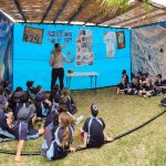Staff member educating students about Sukkot