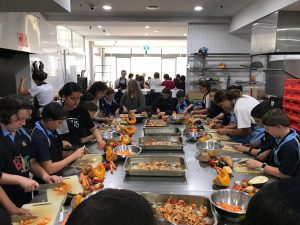 Students engaged in supervised cooking
