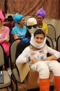 Student in a space costume at PURIM celebration